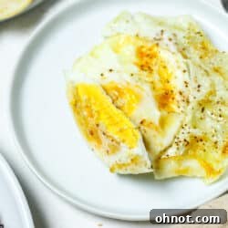 Over hard eggs on white plate