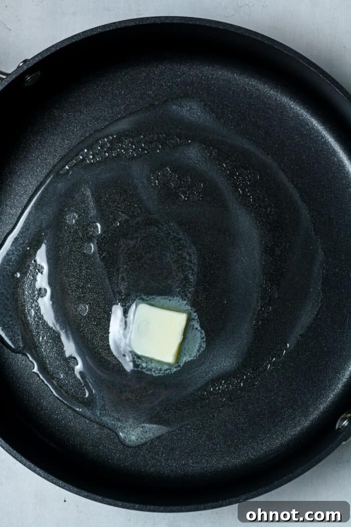 Butter in skillet before melting