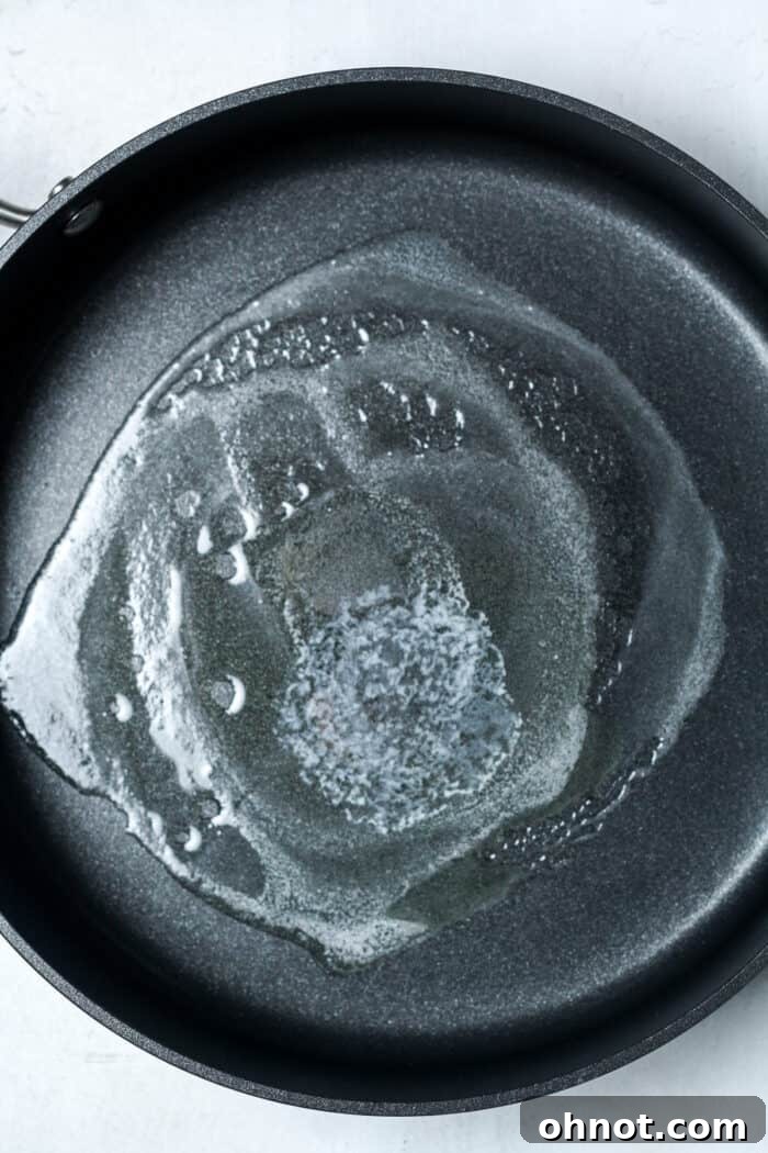Melted butter in skillet, ready for eggs