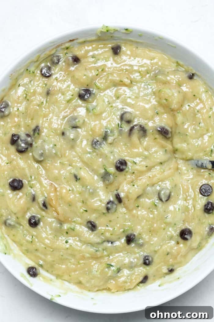 Zucchini muffin batter in bowl