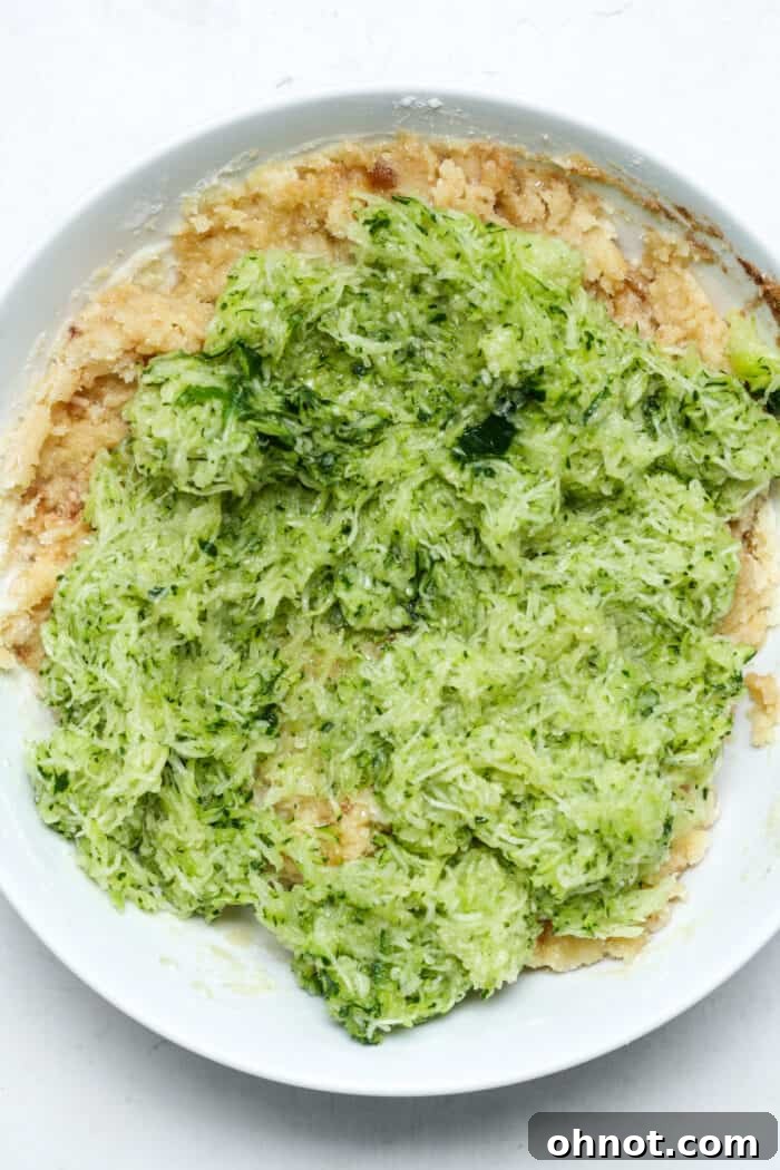 Grated zucchini in bowl