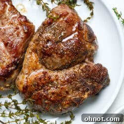 Sous vide lamb chops on white plate