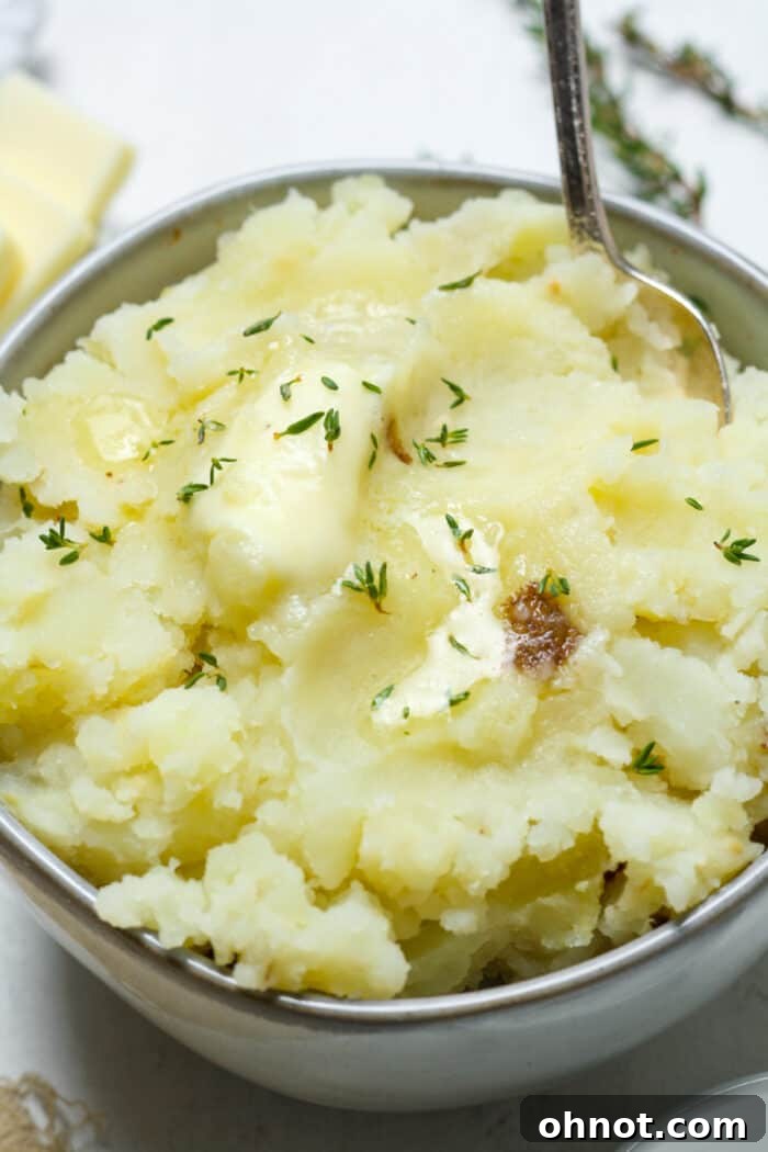 Dairy free mashed potatoes in bowl with dairy free butter