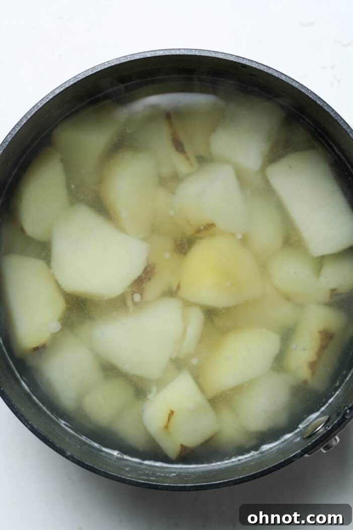 Potatoes and water in pan