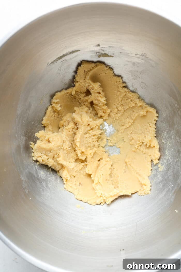 Creamed butter and brown sugar mixture in a mixing bowl