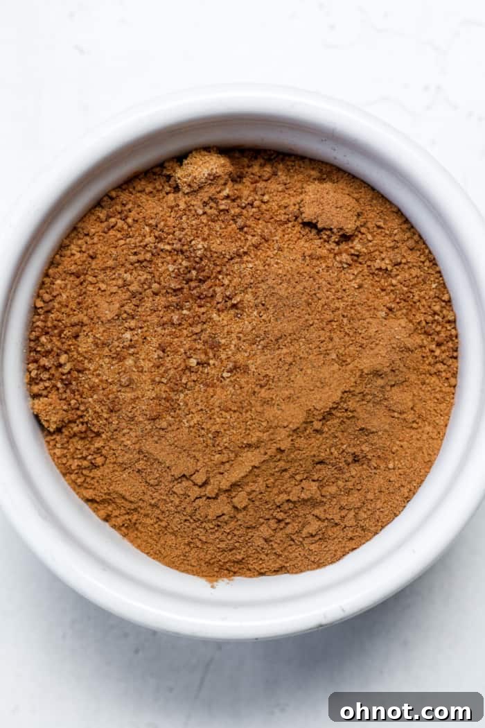 A small bowl filled with coconut sugar, an essential component of the cinnamon swirl for the vegan coffee cake.