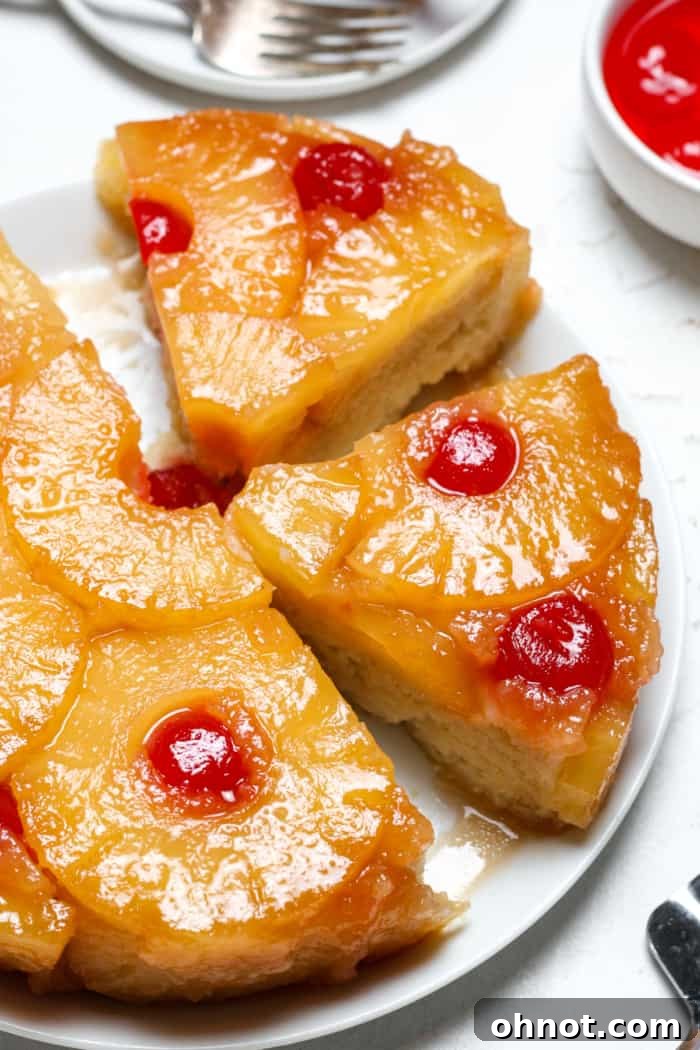Vegan pineapple upside down cake with cherries, beautifully arranged with a golden crust.