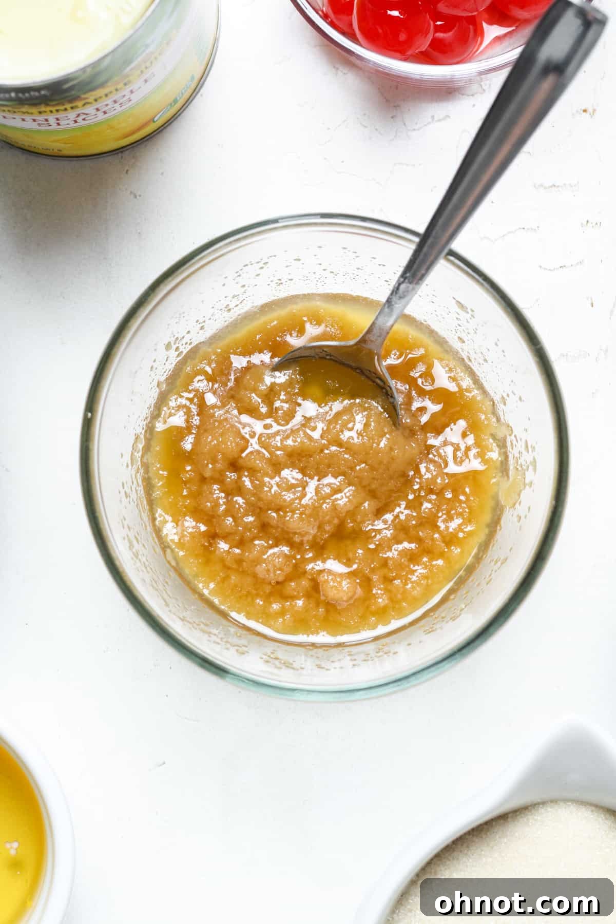 Melted butter and coconut sugar being mixed in a bowl.