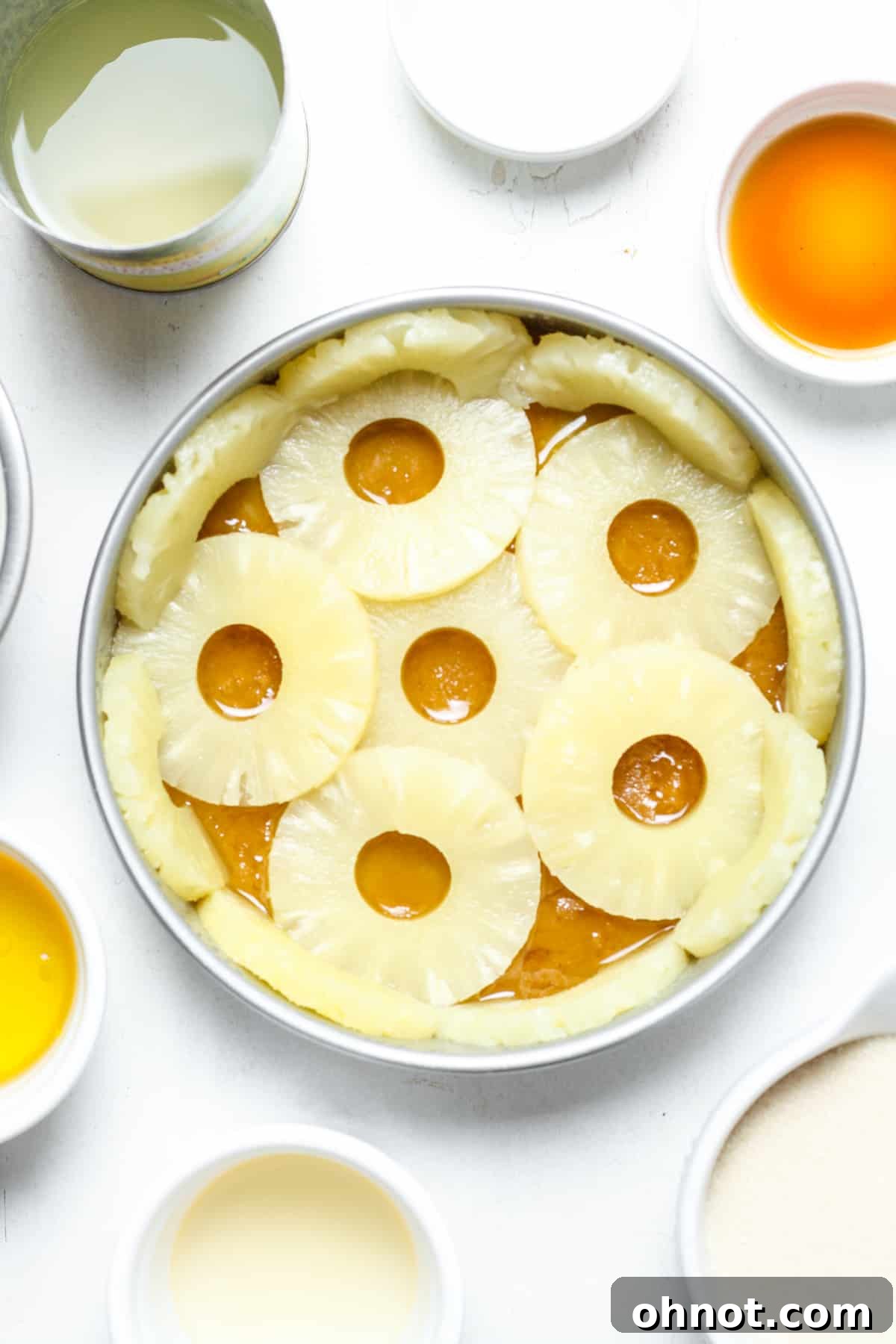 Pineapple rings carefully placed in the cake pan over the caramel layer.