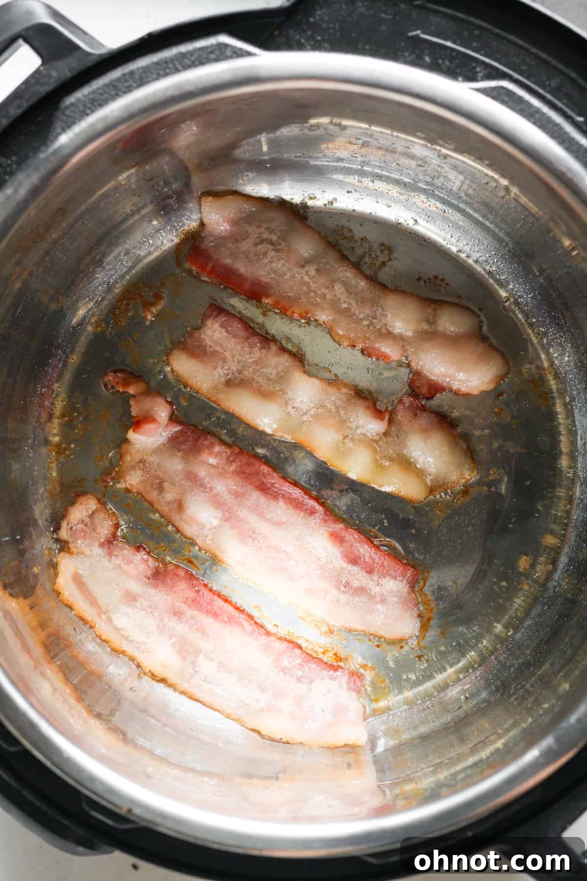 Bacon cooking and turning golden brown in the Instant Pot