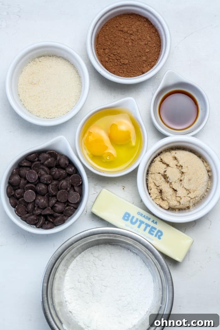 Assorted gluten-free brownie ingredients: chocolate chips, eggs, butter, and gluten-free flour