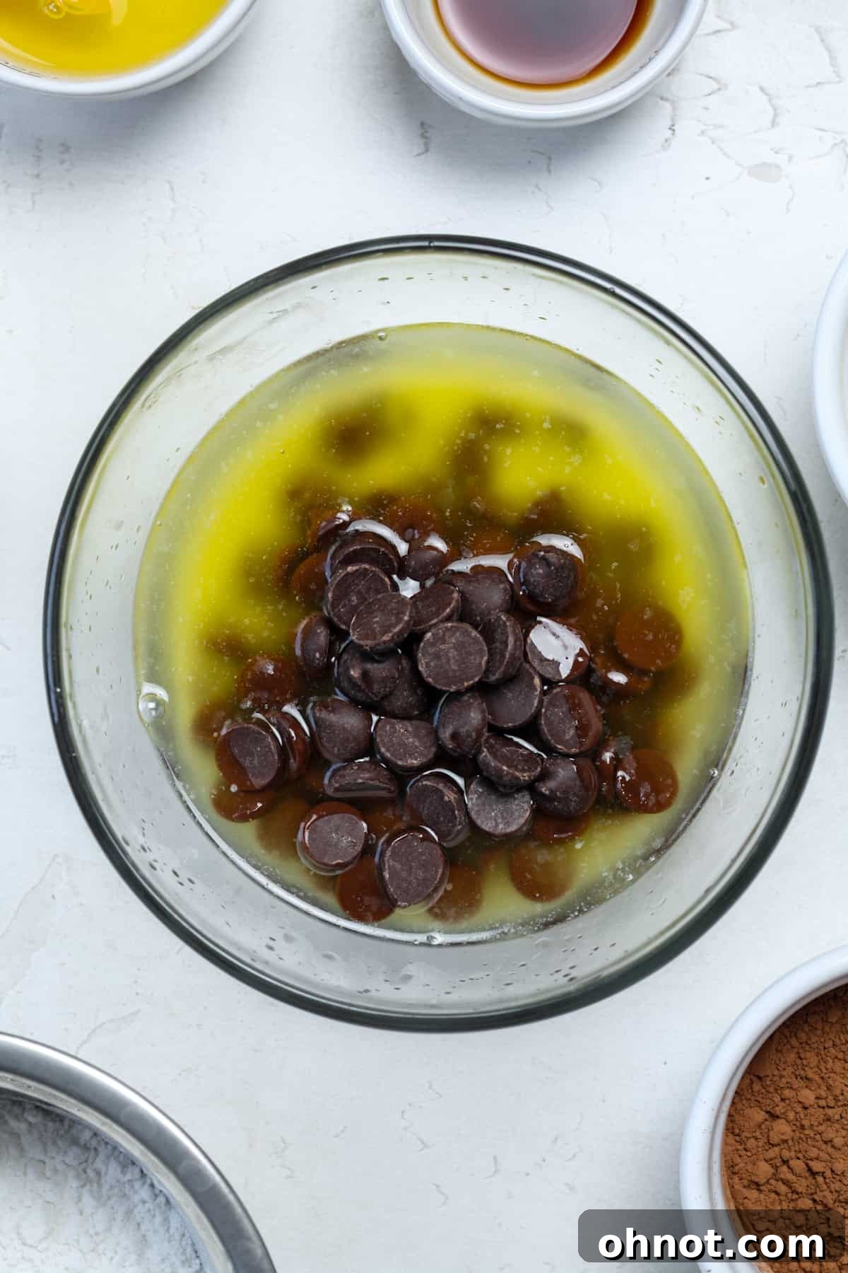 Melted butter and chocolate chips stirred together in a bowl