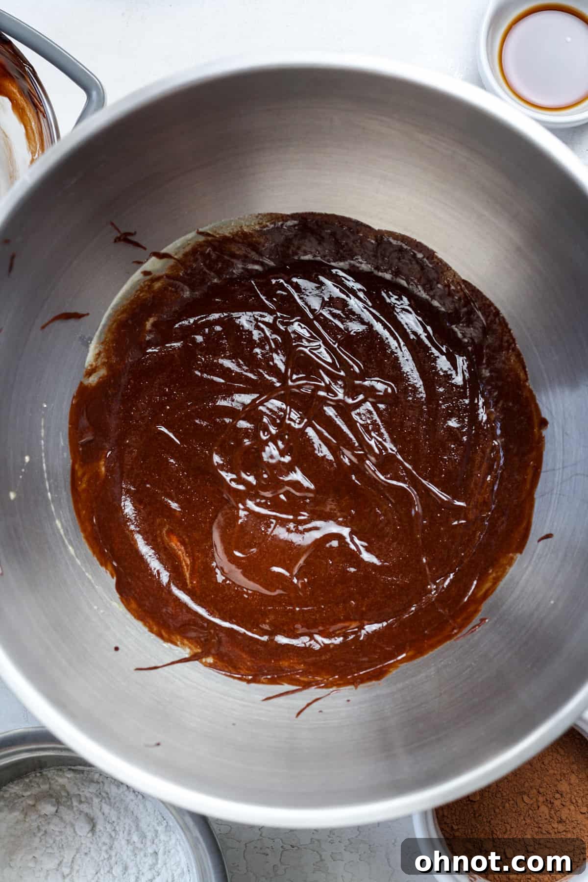 Smooth and glossy brownie ganache-like mixture in the mixing bowl