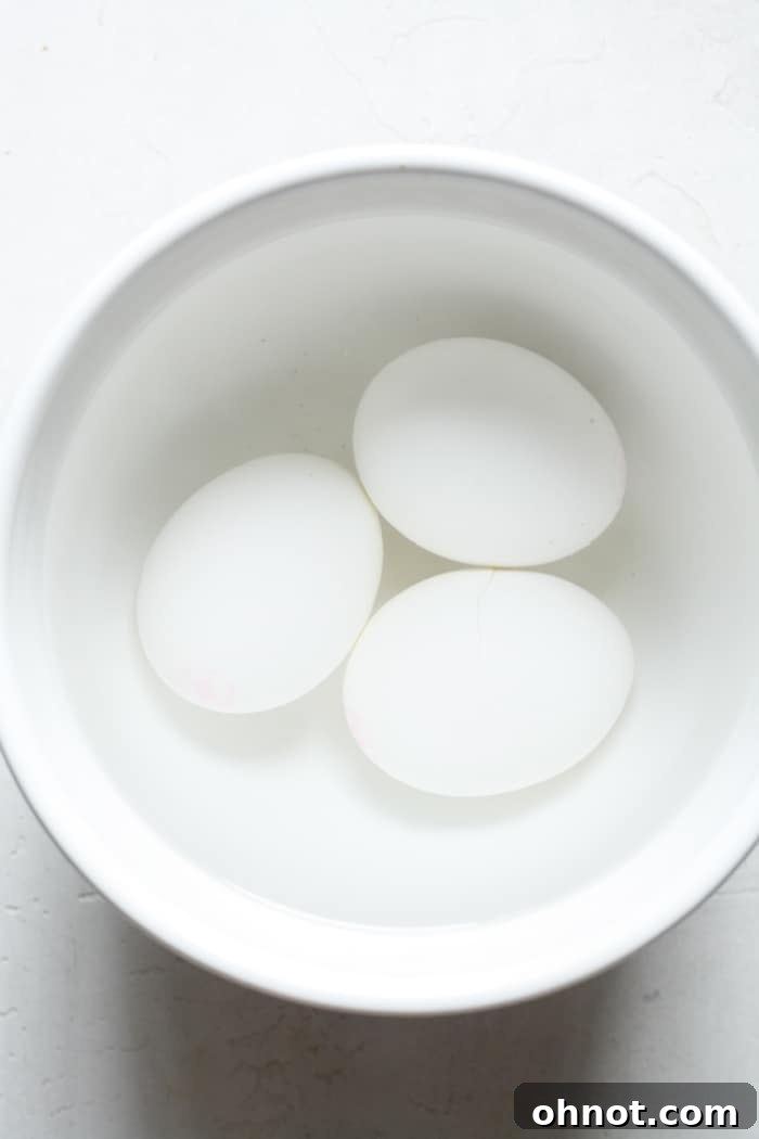 Eggs in white bowl with water