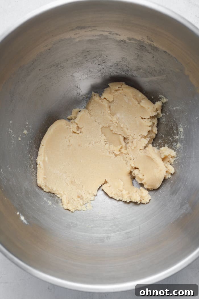 Close-up of beaten butter and sugar mixture in a mixing bowl