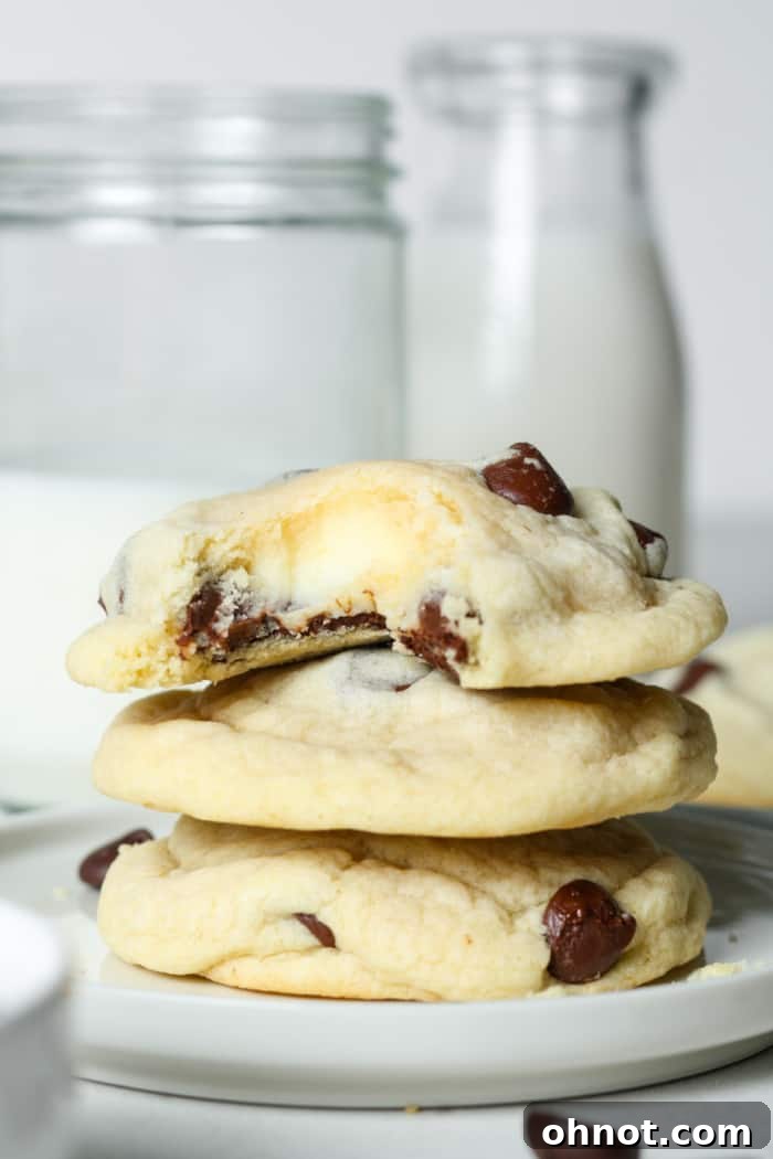 Delicious Chocolate Chip Cheesecake Cookies on a plate, showcasing their soft texture and creamy filling.