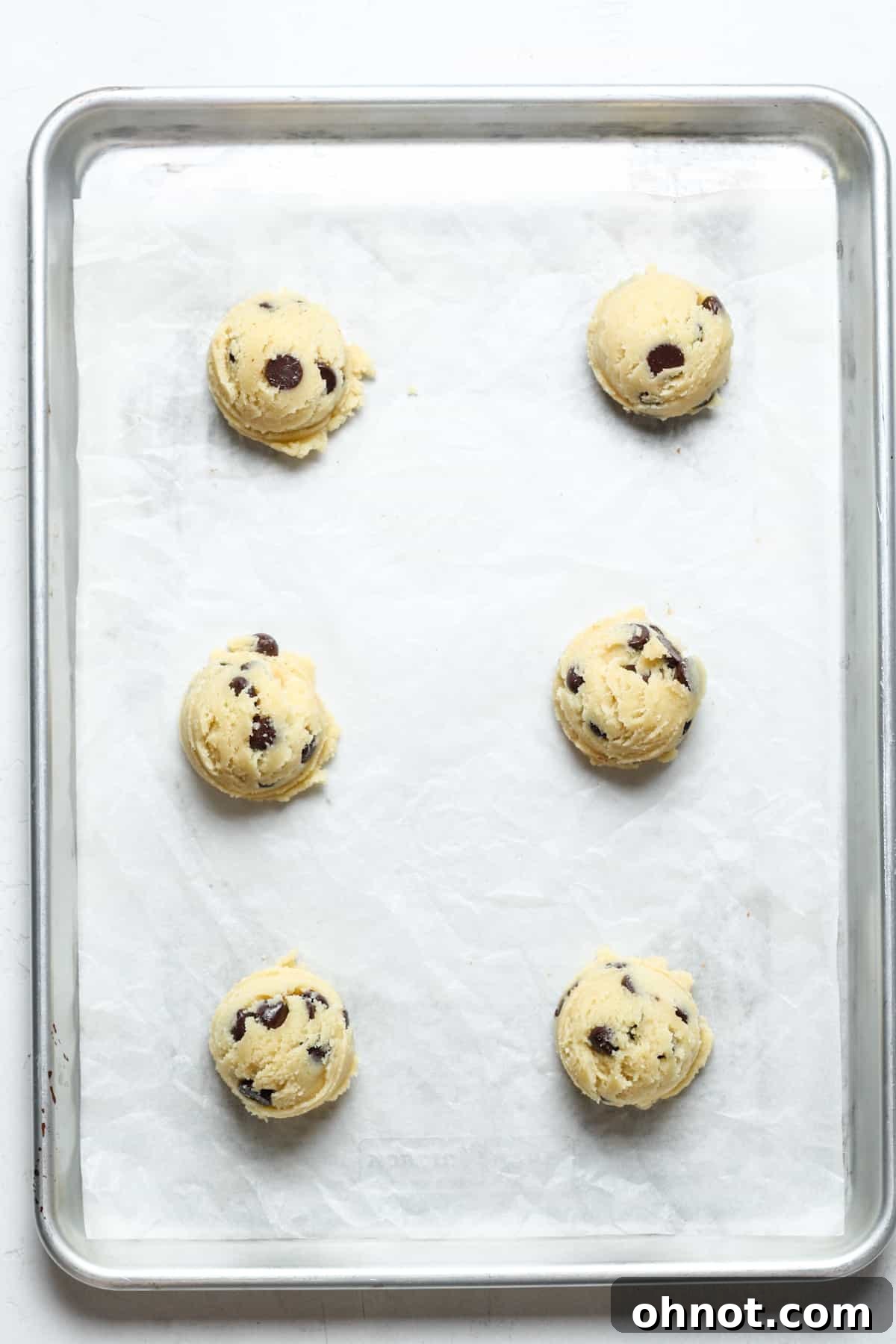 Balls of keto cookie dough on pan