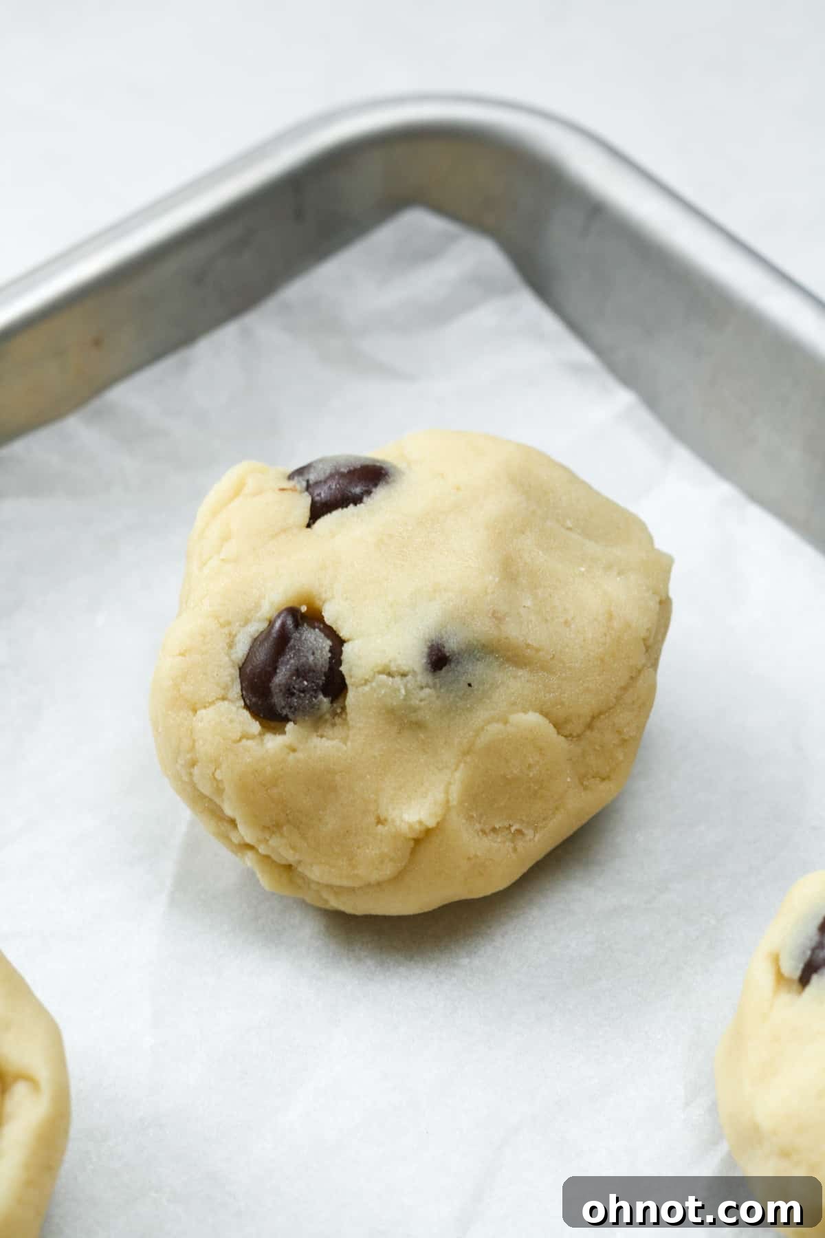 Thick, sealed cookie dough ball with caramel inside