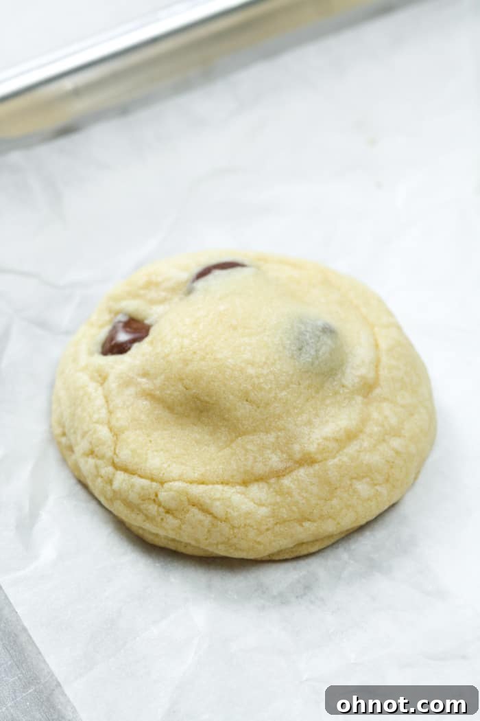 Freshly baked caramel chocolate chip cookies on a baking pan