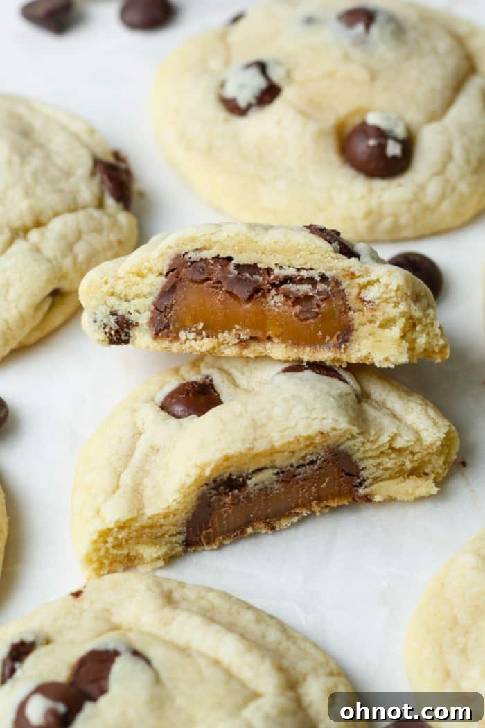 Thick cookies showcasing their gooey caramel filling