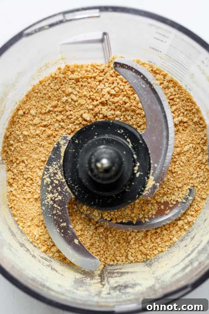Shortbread cookies processed into fine crumbs in a food processor.
