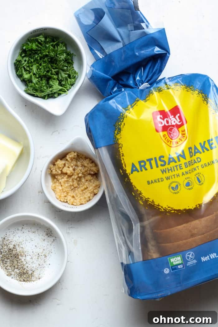 Gluten-free bread slices generously spread with a fragrant garlic butter mixture, before baking.