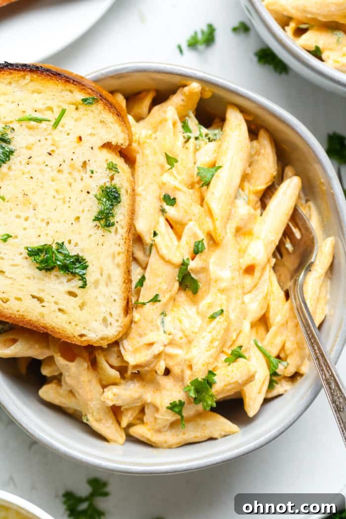 Gluten-free garlic bread served alongside a bowl of pasta, creating a complete and inviting meal.