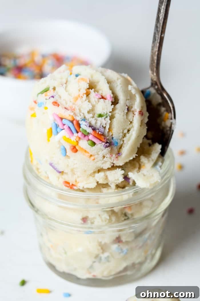 Jar of irresistible edible sugar cookie dough, perfect for a quick and safe treat.