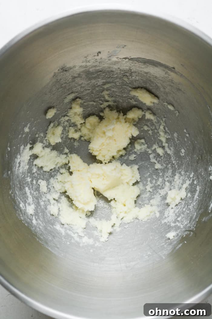 A small amount of creamed butter and sugar in a mixer bowl.
