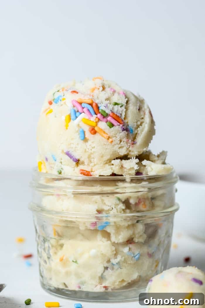 Delicious edible dough topped with colorful sprinkles, presented attractively.