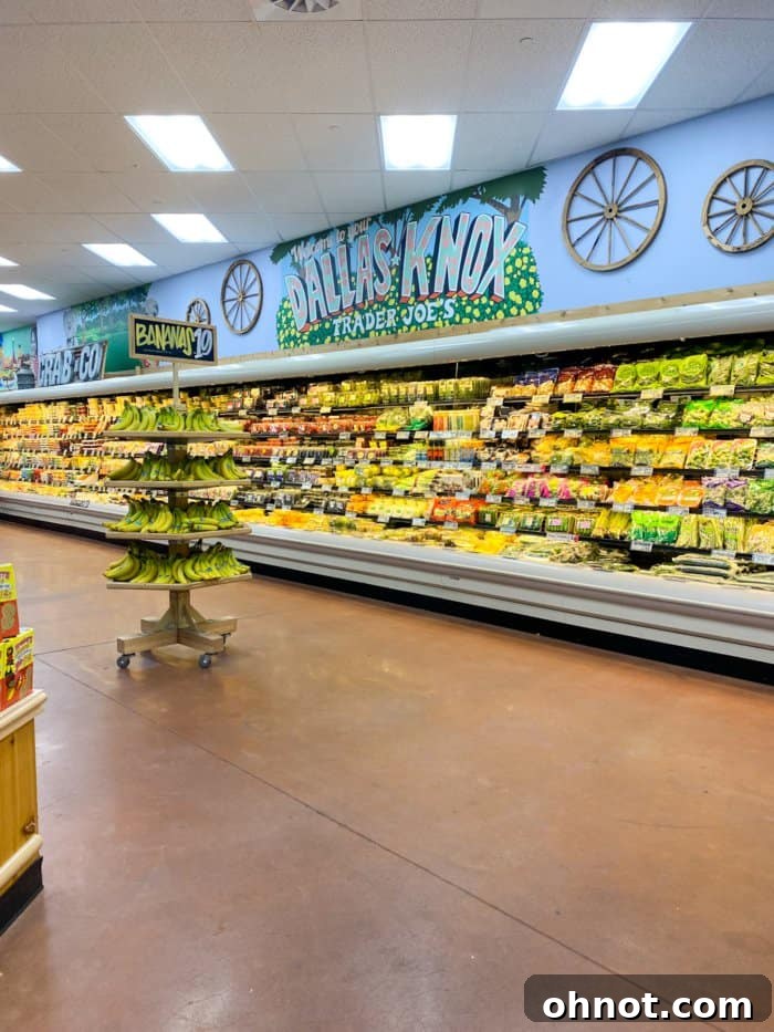 A vibrant produce aisle at a Trader Joe's grocery store, symbolizing freshness and a wide selection of healthy options.