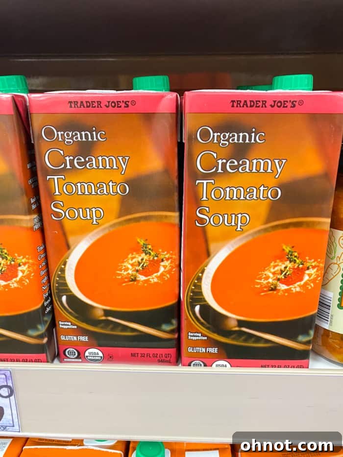 A container of creamy tomato soup from Trader Joe's, perfect for a comforting meal.