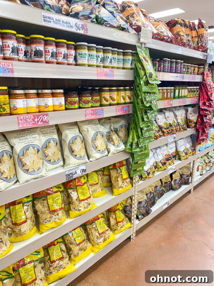 The vibrant tortilla chip aisle at Trader Joe's, featuring a variety of gluten-free options and colorful packaging.