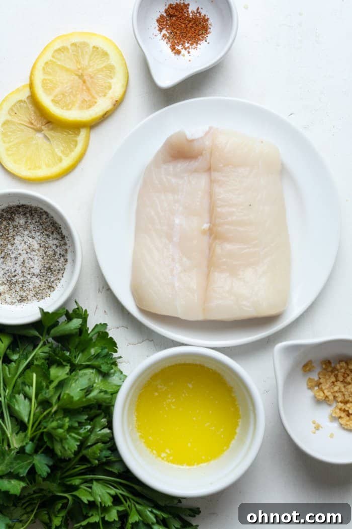 Close-up of a succulent baked halibut fillet covered in a glossy garlic butter sauce, garnished with fresh herbs.