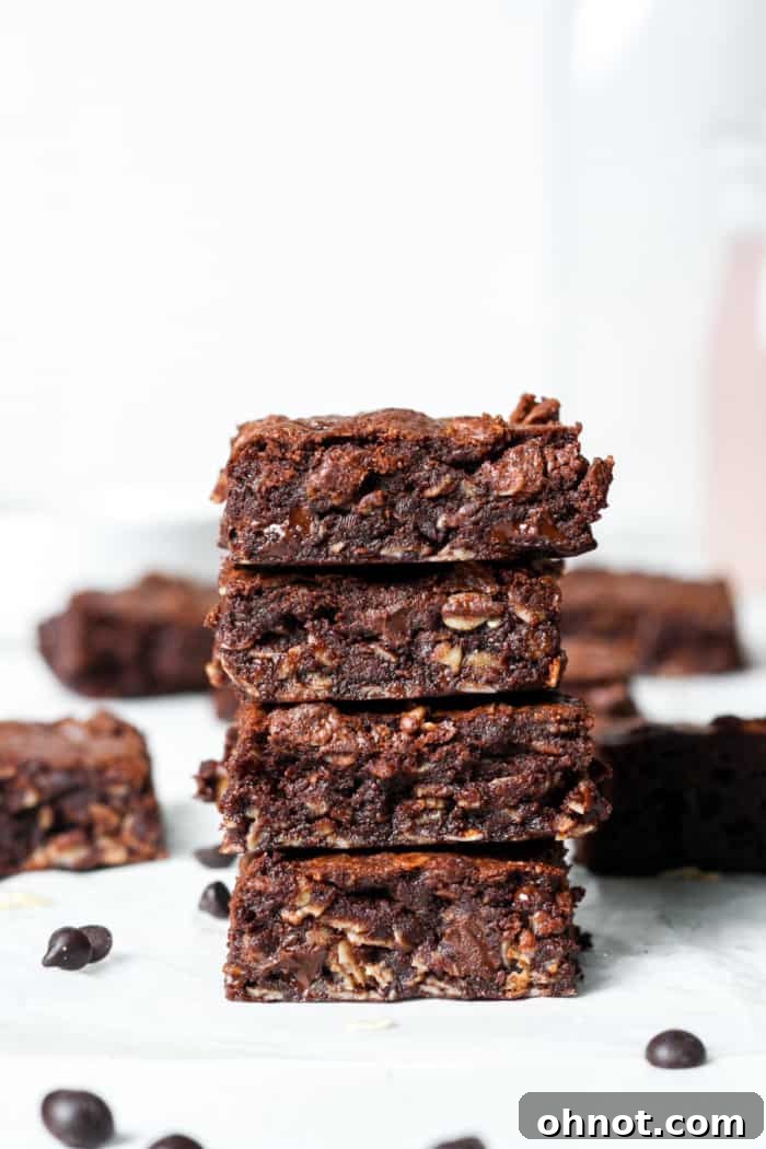 A stack of perfectly baked lactation brownies, ready to be enjoyed as a healthy, fudgy treat.