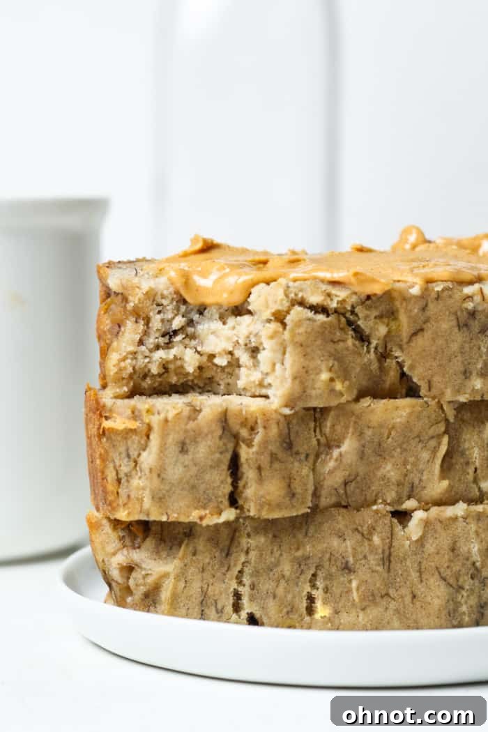 No sugar added banana bread. A close-up of a perfectly baked, sugar-free banana bread loaf, still warm and inviting.