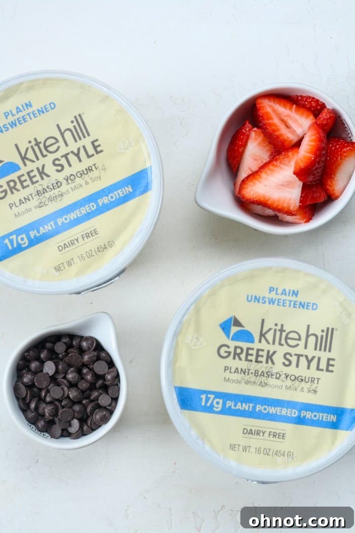 Creamy Greek yogurt spread on a baking sheet, ready for toppings.