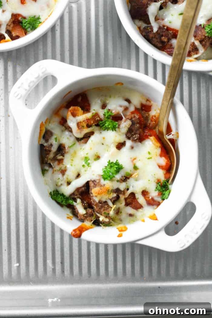 Freshly baked crustless pizza bowl, with melted, bubbly cheese and golden-brown toppings.