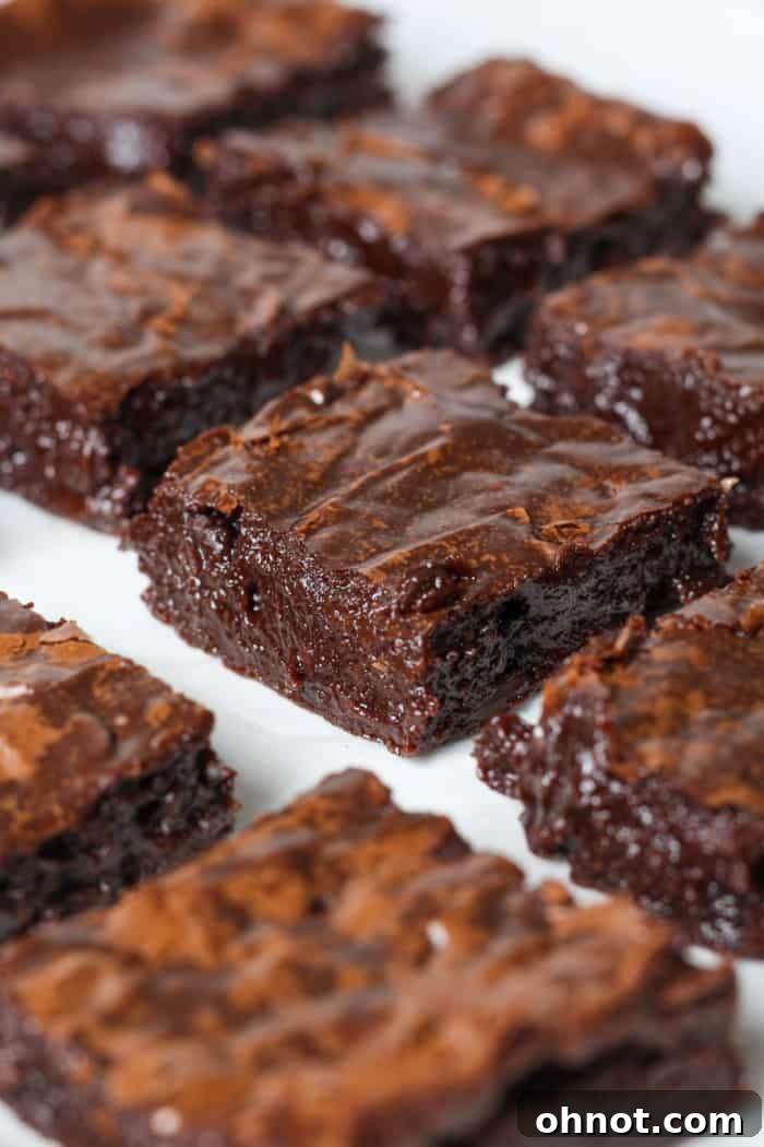 A stack of rich, dark dairy-free chocolate brownies, perfect for a treat.