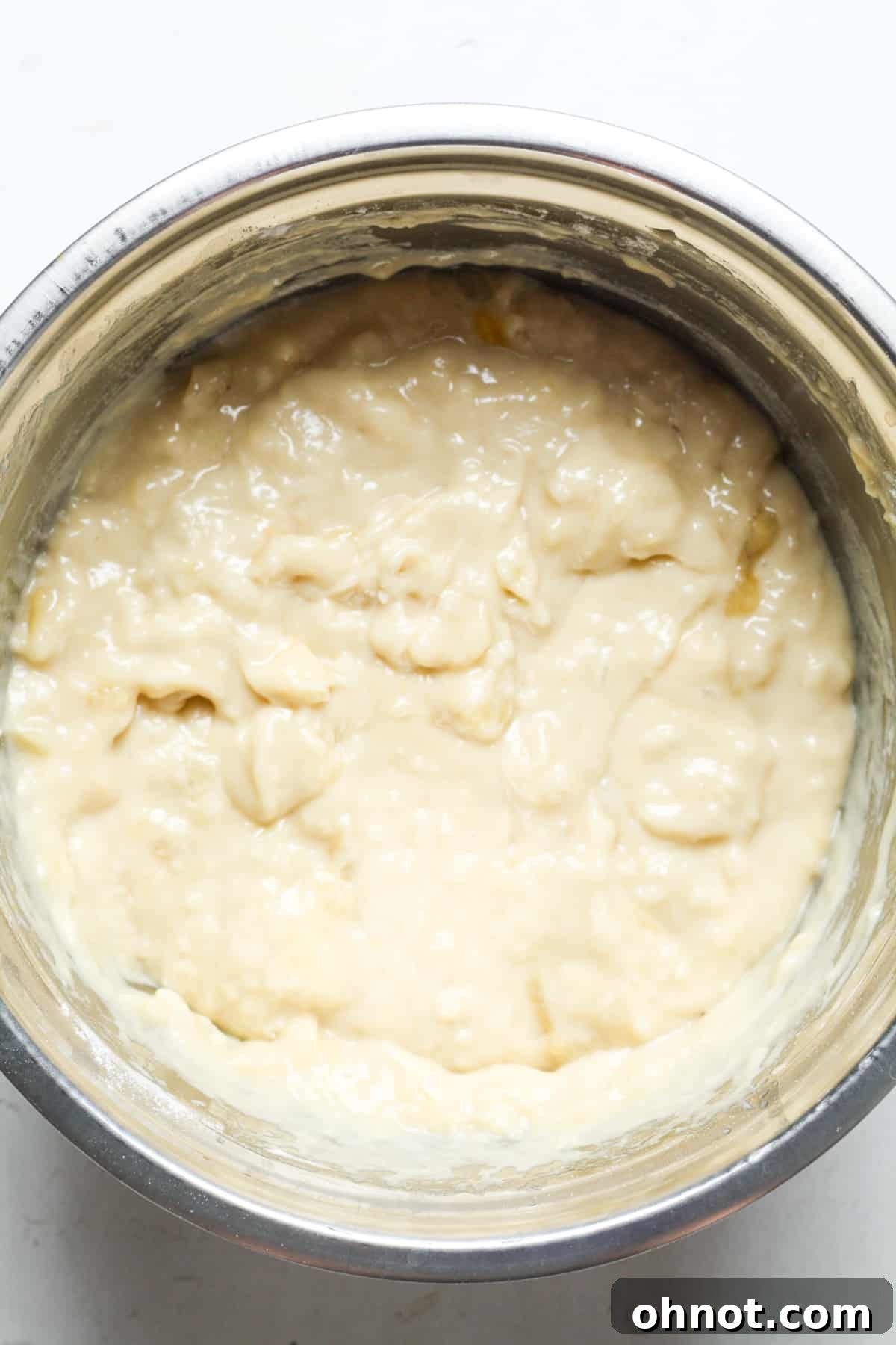 The thick, creamy banana bread batter after the dry ingredients have been stirred in.