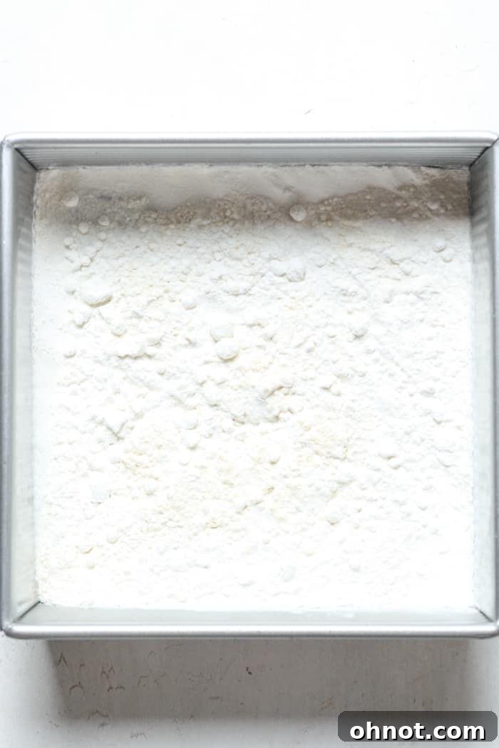 Flour spread on a baking pan, undergoing the heat treatment process.