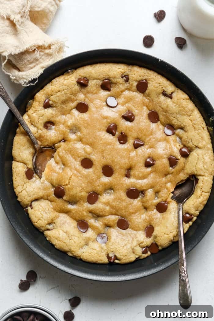 A golden brown mini skillet cookie, fresh out of the oven.