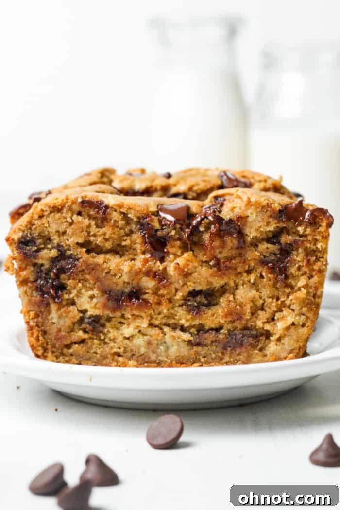 A slice of moist banana bread showing its tender crumb.