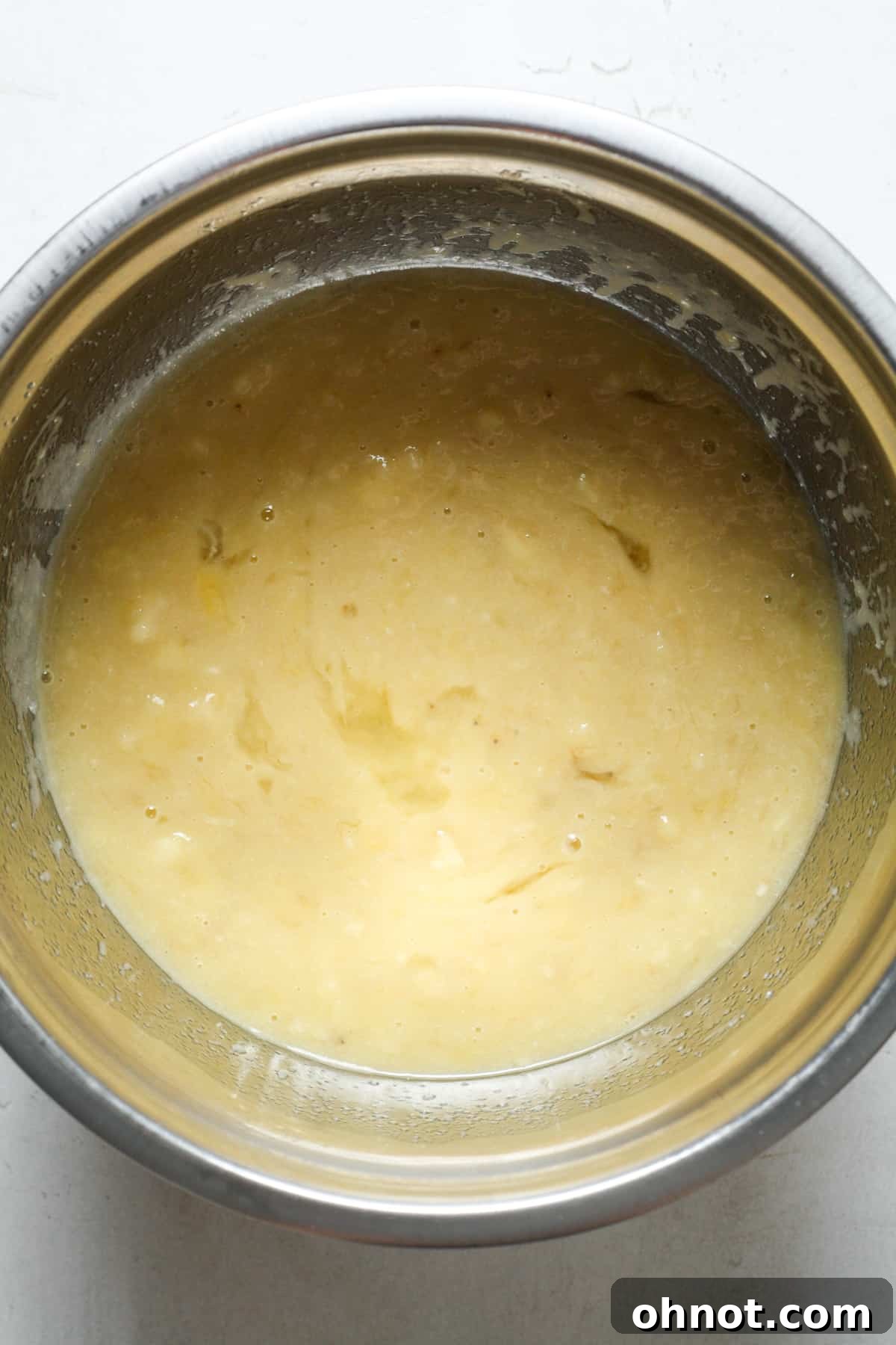 Smooth, well-combined wet banana bread batter.