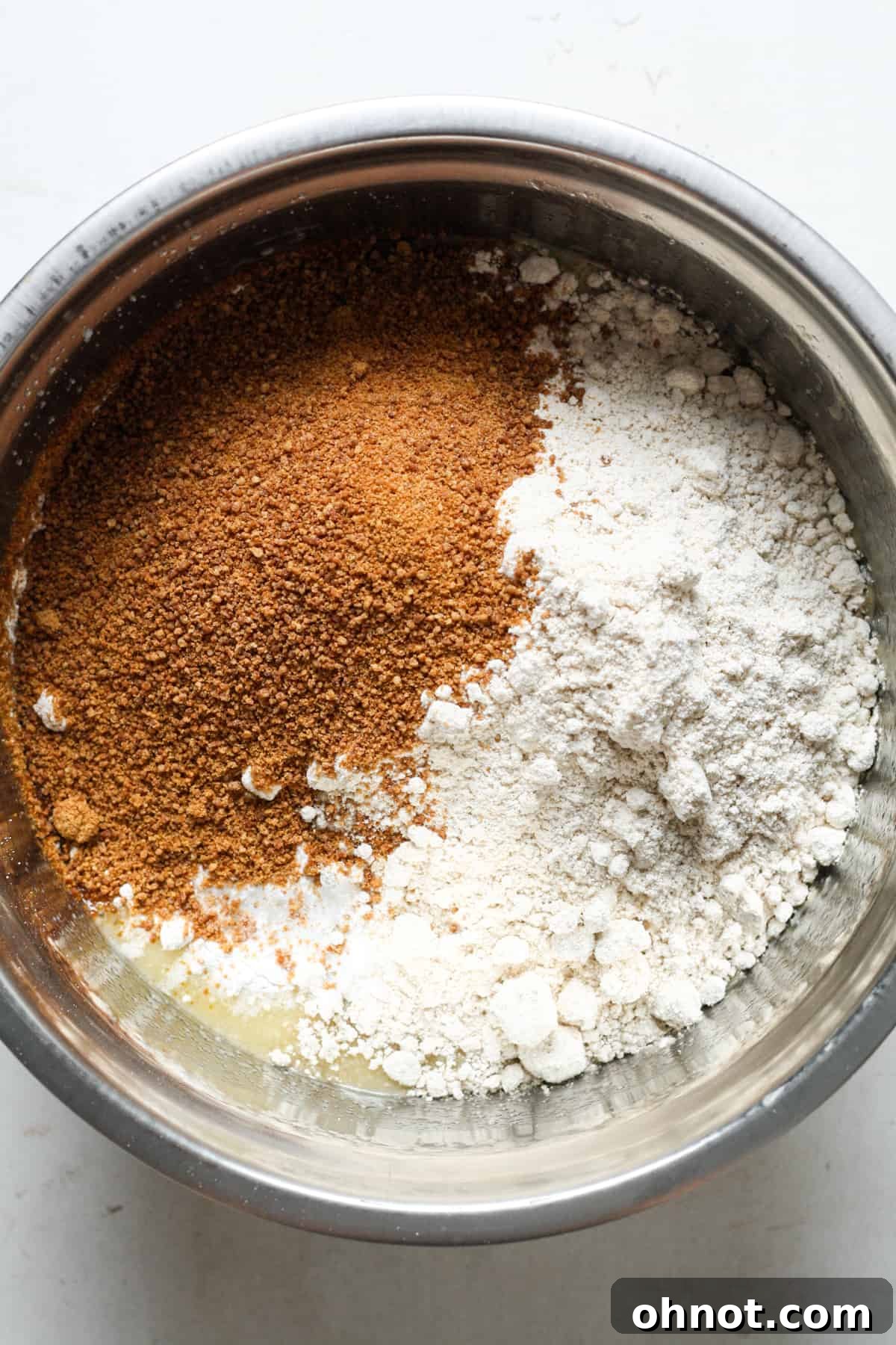 Coconut sugar and oat flour added to the wet mixture in a bowl.