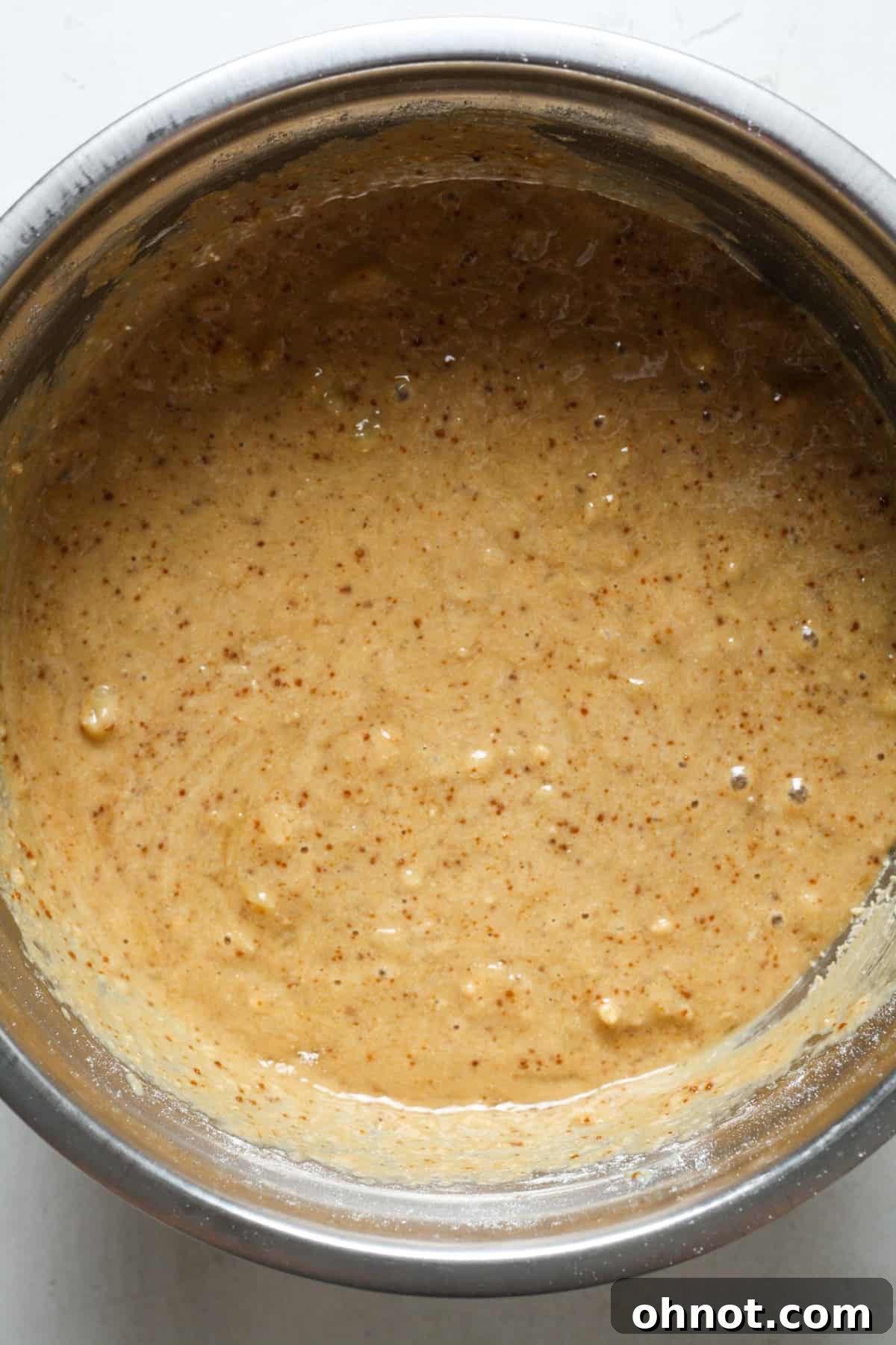 Banana bread batter with dry ingredients just combined, before chocolate chips.