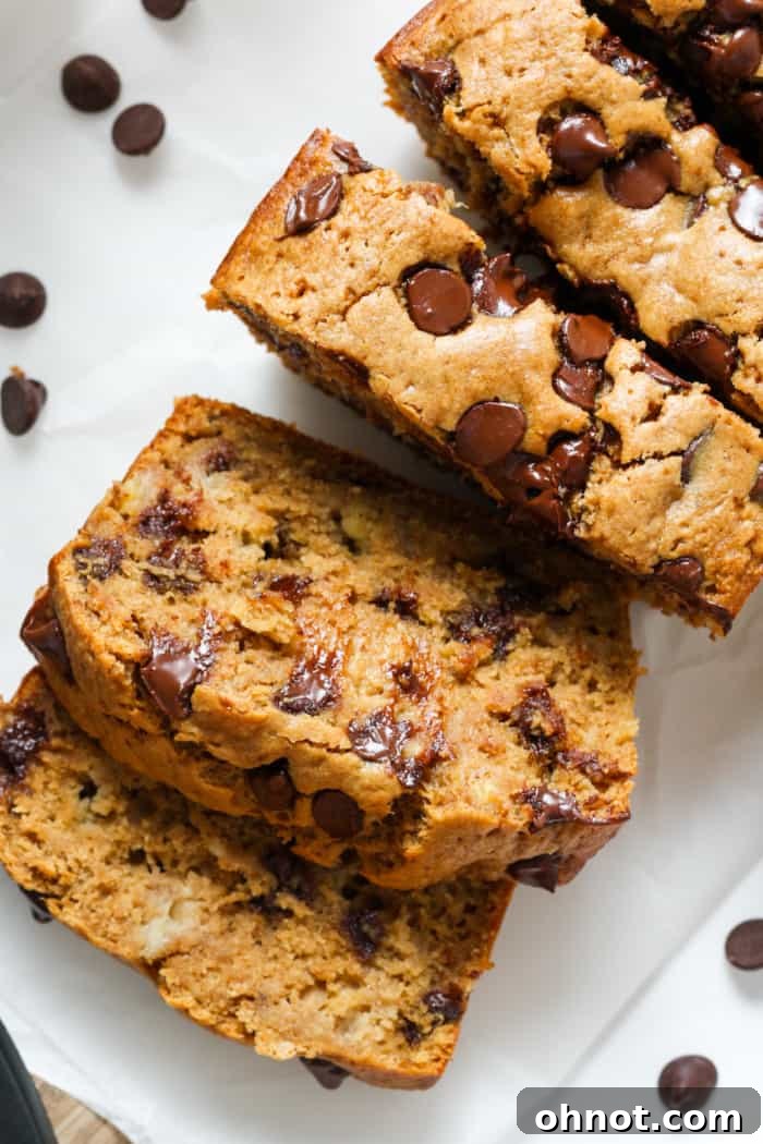 Slice of moist oat flour banana bread on a serving plate.