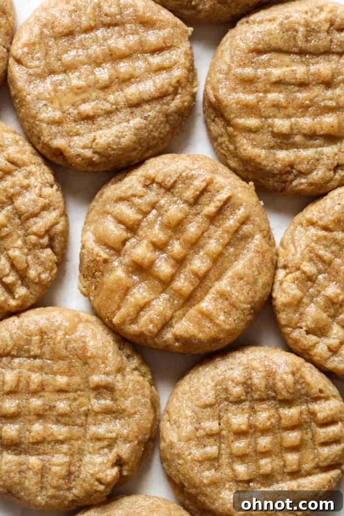 Irresistible 3-ingredient peanut butter cookies cooling on a wire rack.