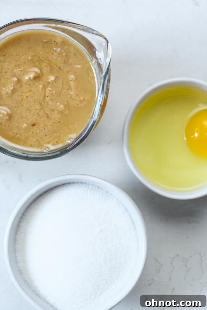 The three essential ingredients for peanut butter cookies: peanut butter, sugar, and egg.