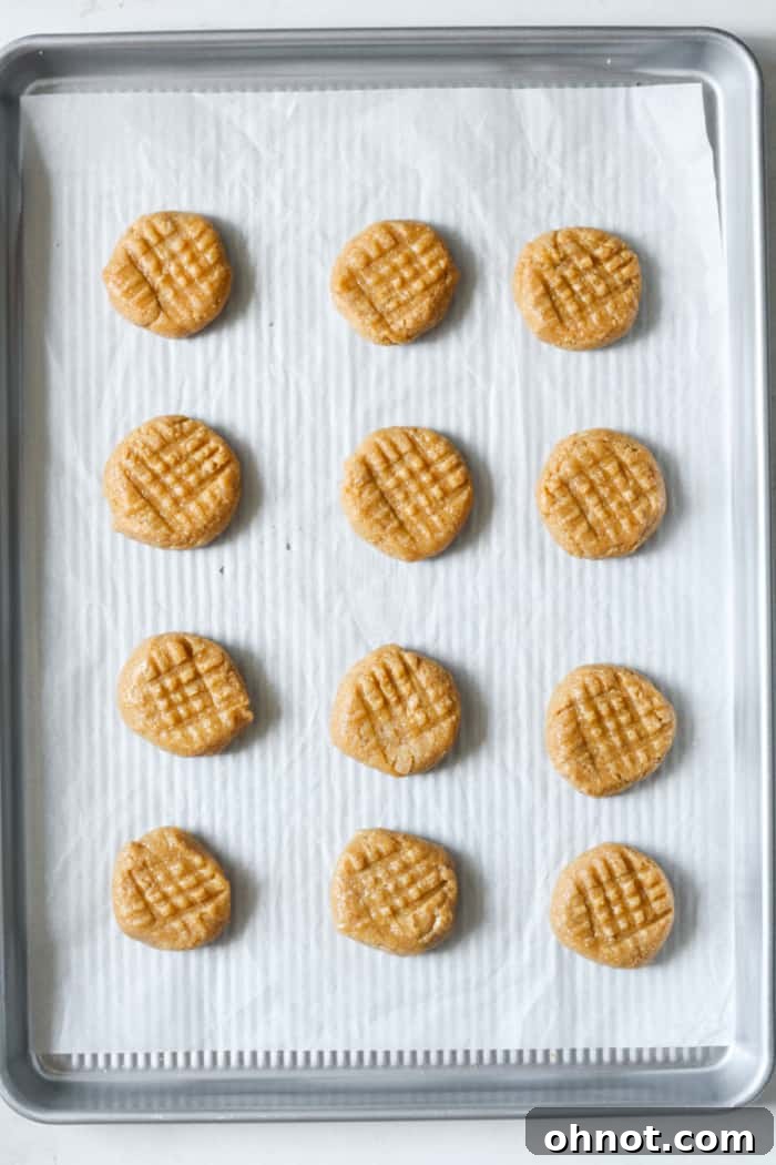 Peanut butter cookie dough balls with the iconic criss-cross fork pattern.